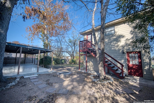 view of home's exterior with a wooden deck