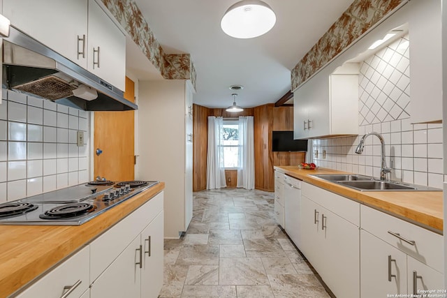 kitchen with backsplash, white dishwasher, sink, white cabinetry, and stainless steel gas stovetop