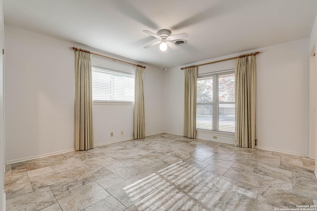 unfurnished room with ceiling fan