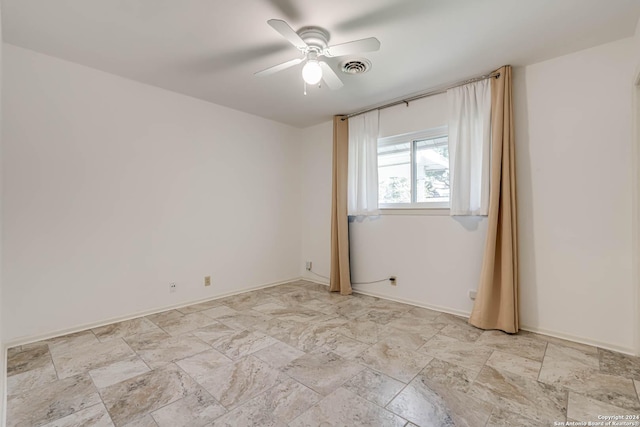 unfurnished room featuring ceiling fan