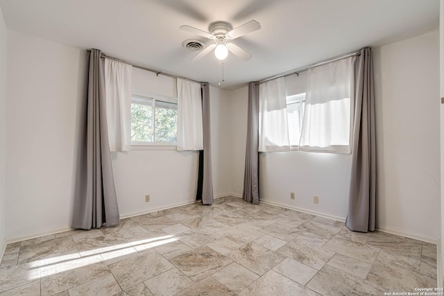 spare room featuring ceiling fan