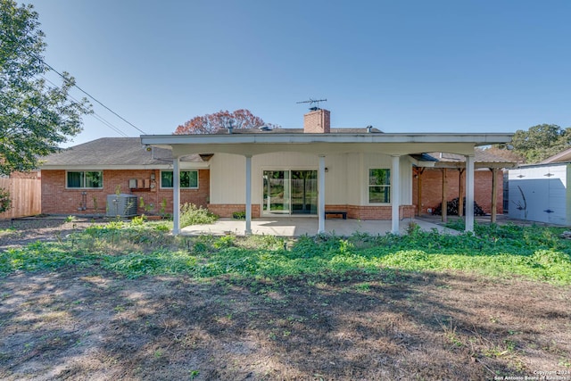 rear view of property featuring a patio and central AC unit