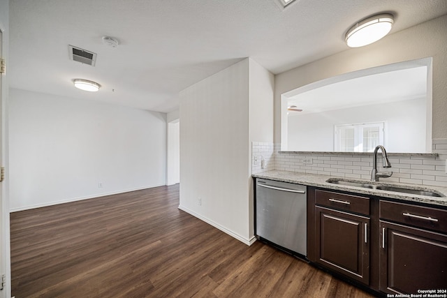 kitchen with dishwasher, backsplash, sink, dark hardwood / wood-style flooring, and dark brown cabinetry