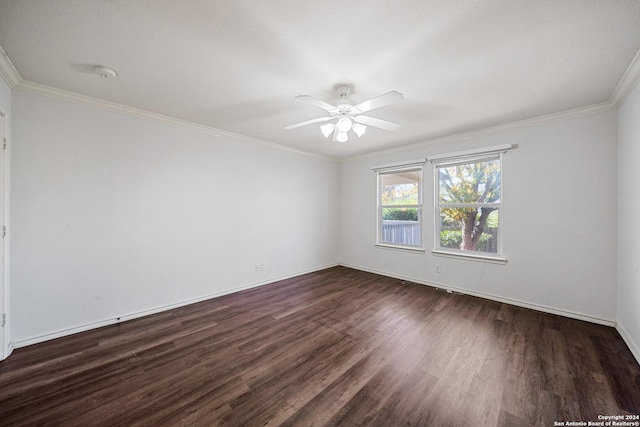 spare room with ceiling fan, dark hardwood / wood-style flooring, and ornamental molding