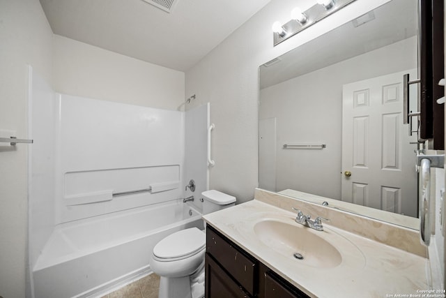 full bathroom with toilet, vanity, tile patterned floors, and washtub / shower combination