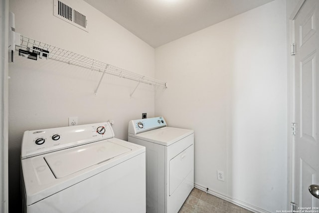 laundry area with independent washer and dryer