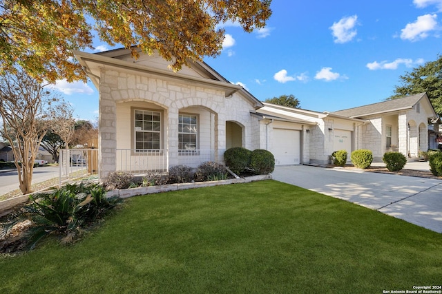 view of front facade with a garage and a front lawn