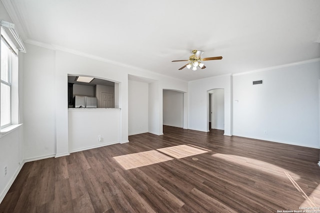 unfurnished living room featuring dark hardwood / wood-style flooring, ceiling fan, and ornamental molding