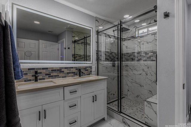 bathroom featuring decorative backsplash, vanity, and walk in shower