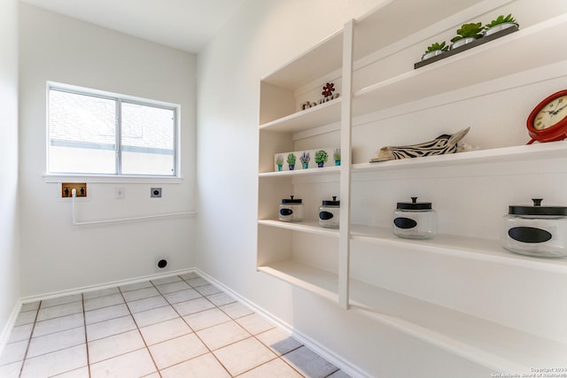 laundry room featuring hookup for a washing machine, light tile patterned flooring, and hookup for an electric dryer