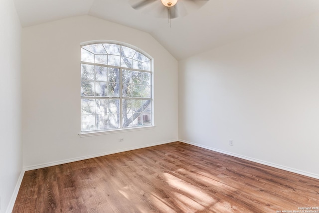 spare room featuring ceiling fan, vaulted ceiling, and hardwood / wood-style flooring