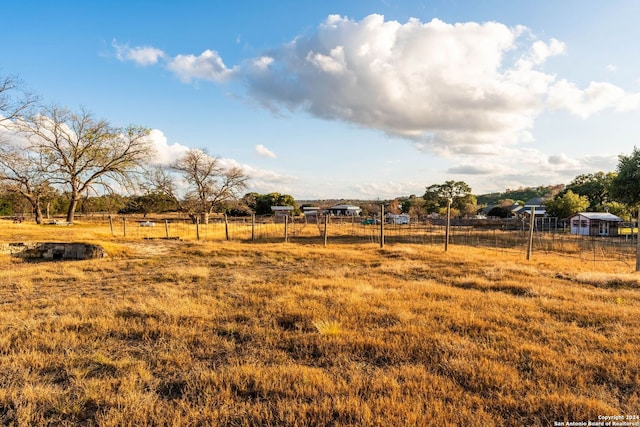 view of yard with a rural view