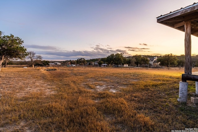 view of yard at dusk