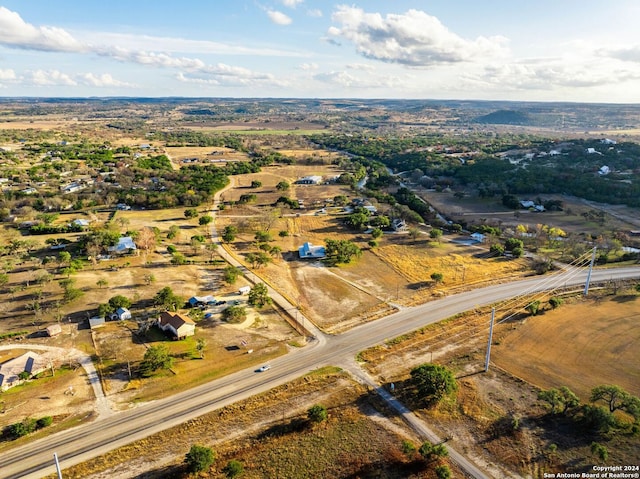 birds eye view of property with a rural view