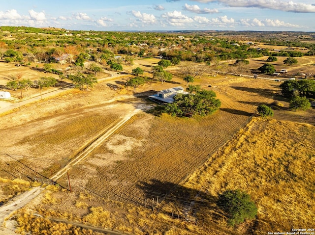 birds eye view of property featuring a rural view