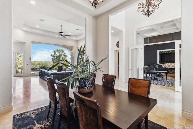 dining space featuring recessed lighting, light tile patterned flooring, a towering ceiling, and baseboards