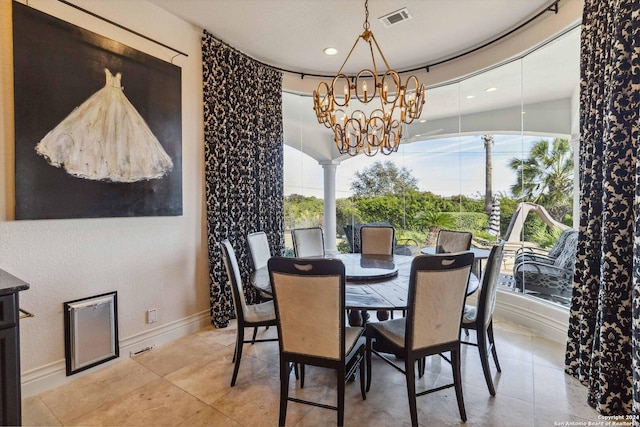 tiled dining area with baseboards, visible vents, ornate columns, a notable chandelier, and recessed lighting