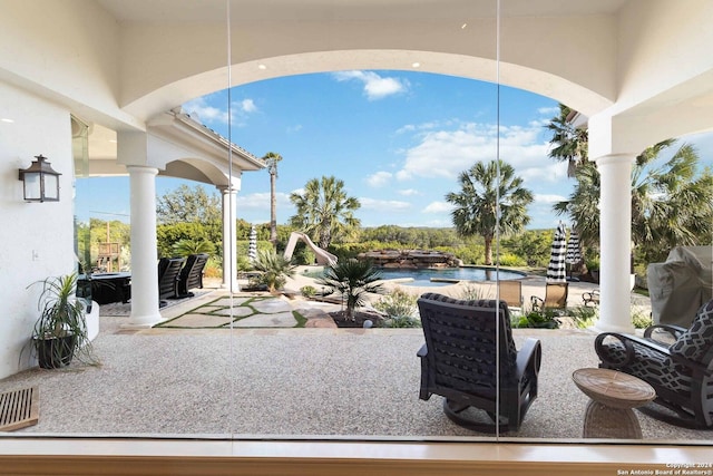 view of patio with an outdoor pool