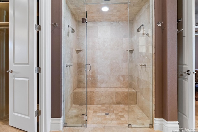 bathroom with a shower stall