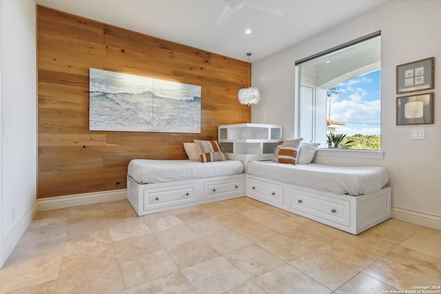 sitting room featuring recessed lighting, a ceiling fan, an accent wall, wooden walls, and baseboards