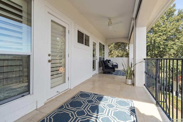 exterior space featuring a sunroom and a ceiling fan