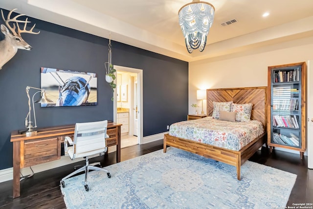 bedroom with baseboards, visible vents, dark wood-style floors, a tray ceiling, and recessed lighting