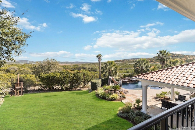 view of yard with a patio area and a water view