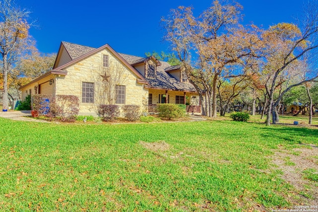 view of front of house with a garage and a front yard