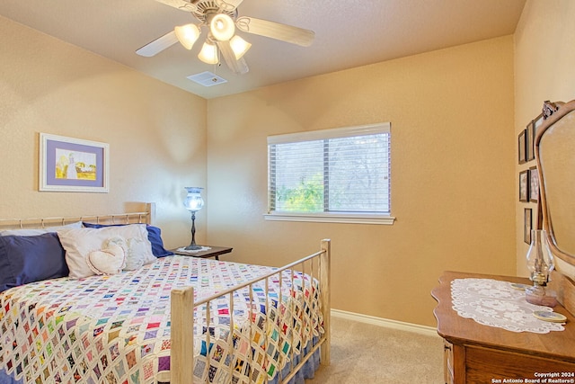 bedroom with light carpet and ceiling fan