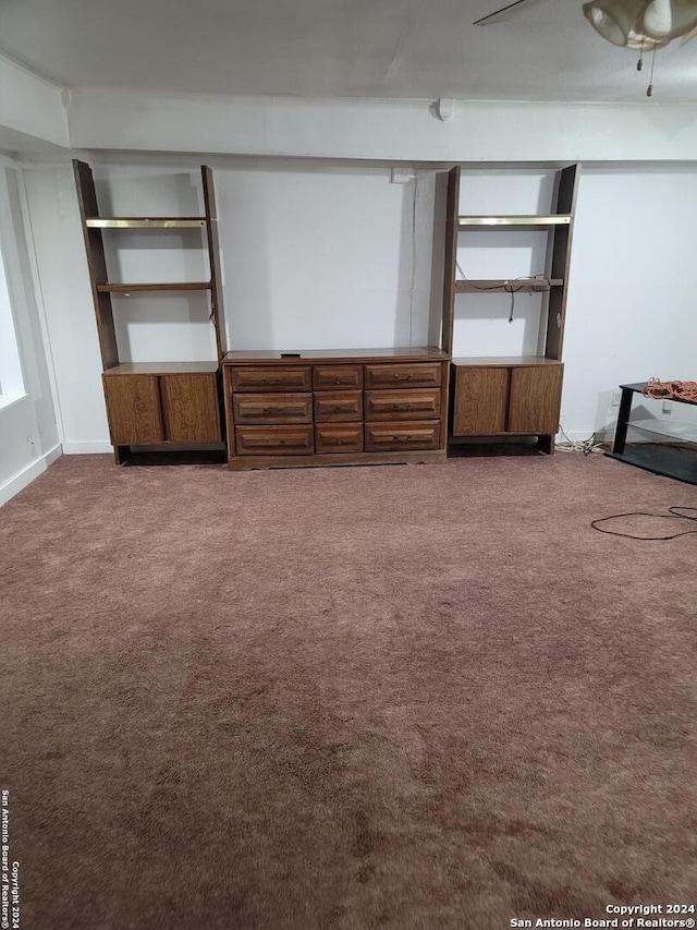 unfurnished living room featuring carpet floors