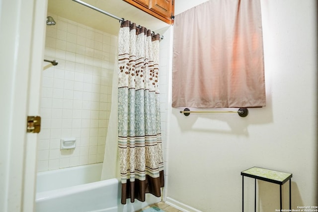 bathroom with shower / tub combo with curtain