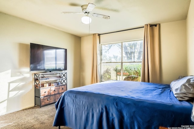 bedroom with ceiling fan and carpet