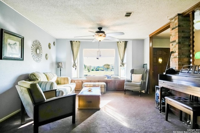 living area featuring ceiling fan, a textured ceiling, and dark colored carpet