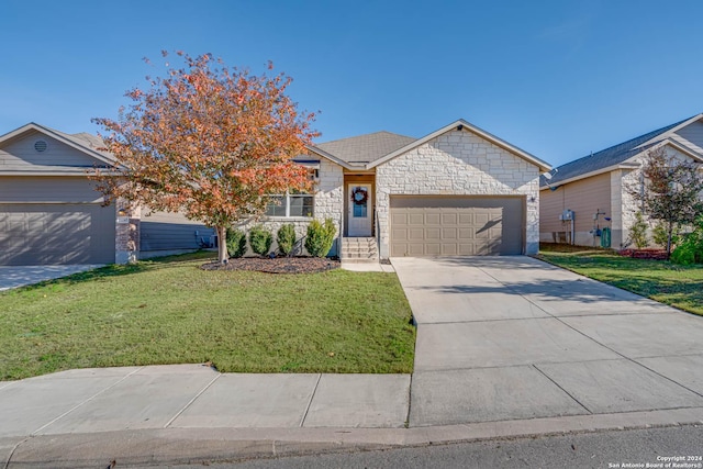 view of front of property featuring a front yard and a garage