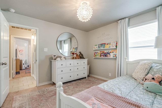 tiled bedroom featuring multiple windows