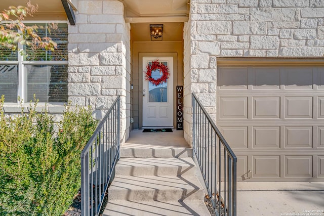 doorway to property featuring a garage