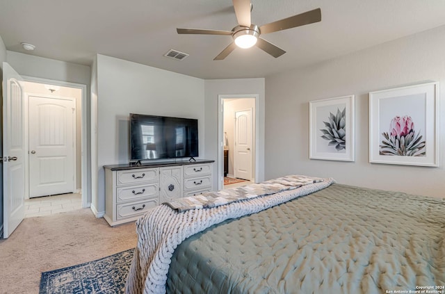 bedroom with light colored carpet and ceiling fan