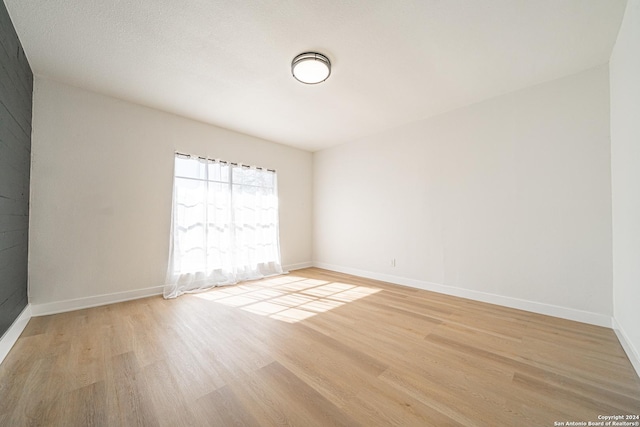 unfurnished room featuring light hardwood / wood-style flooring