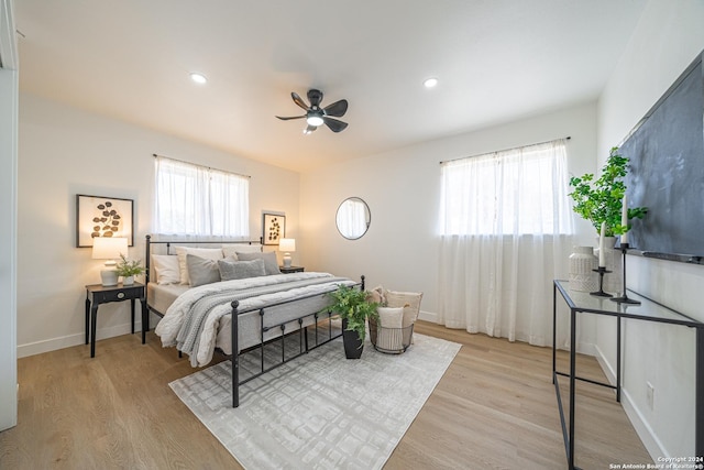 bedroom featuring ceiling fan and light hardwood / wood-style floors