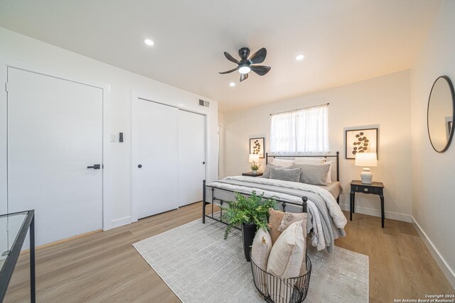 bedroom featuring light hardwood / wood-style flooring and ceiling fan