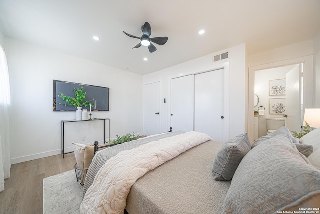 bedroom with ceiling fan and light hardwood / wood-style floors