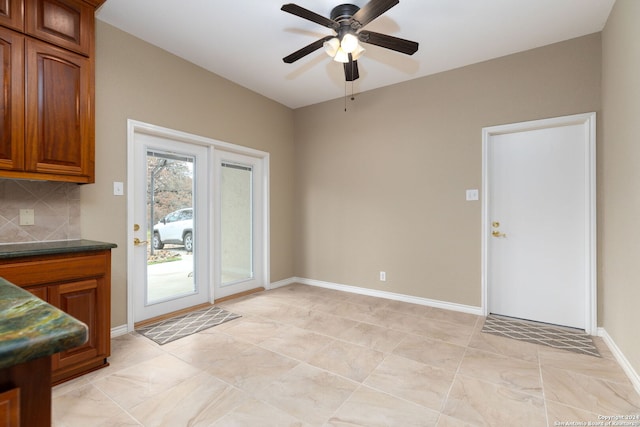 interior space featuring decorative backsplash and ceiling fan