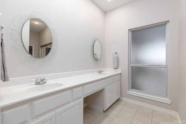 bathroom featuring tile patterned flooring and vanity