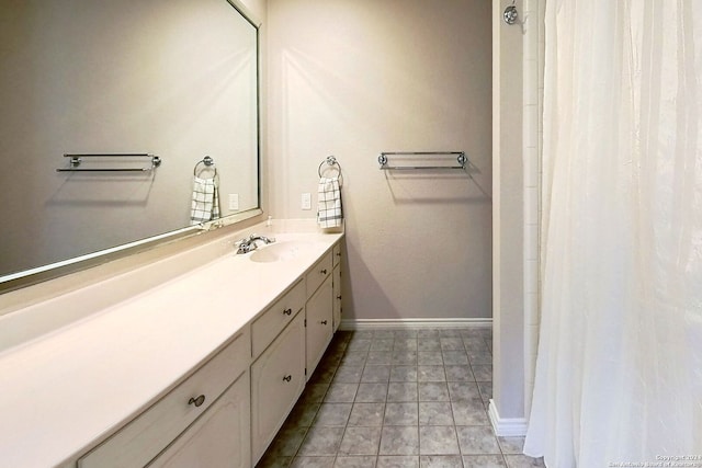 bathroom featuring tile patterned flooring and vanity