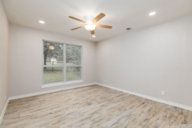 unfurnished room with ceiling fan and light hardwood / wood-style flooring