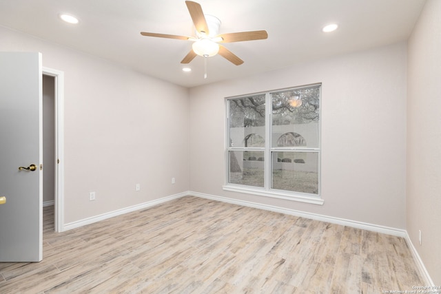 unfurnished room with ceiling fan and light wood-type flooring