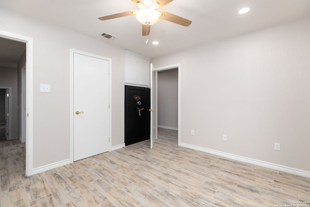 unfurnished bedroom with light hardwood / wood-style floors and ceiling fan