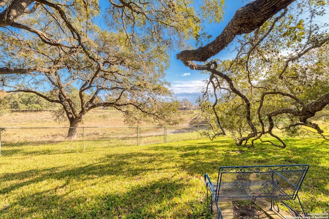 view of yard with a rural view