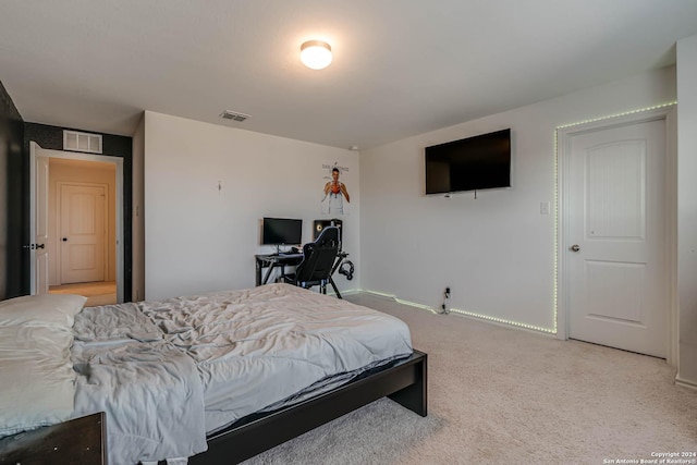 bedroom with light colored carpet