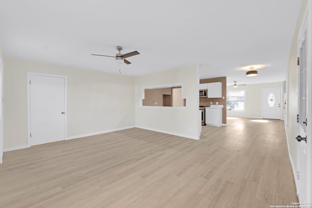 unfurnished living room featuring light wood-type flooring and ceiling fan